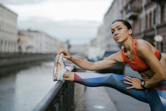 A person stretching and thinking about CBD and running