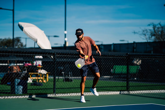 Man playing pickleball with knee pain