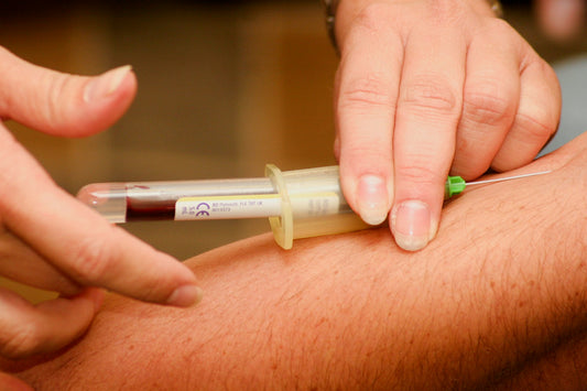 Person getting a cholesterol blood test