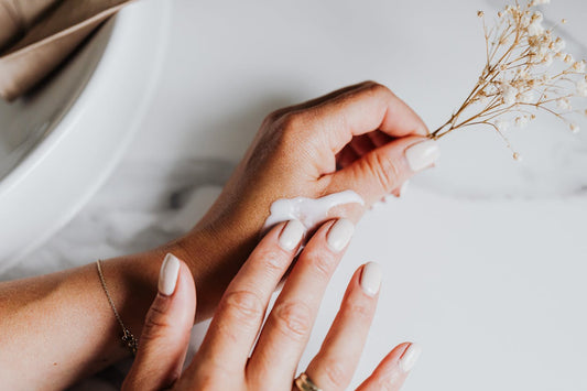 Woman putting on CBD topical cream